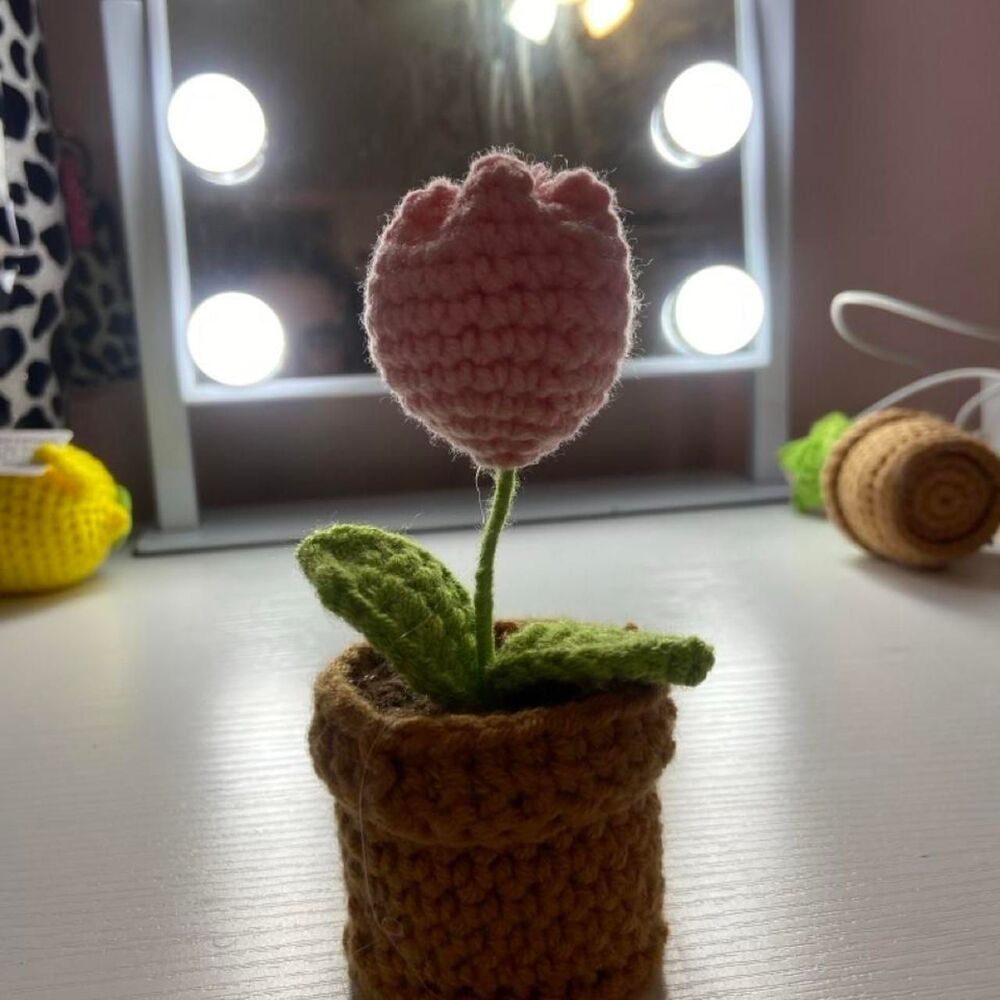 Pink crocheted flower in a pot